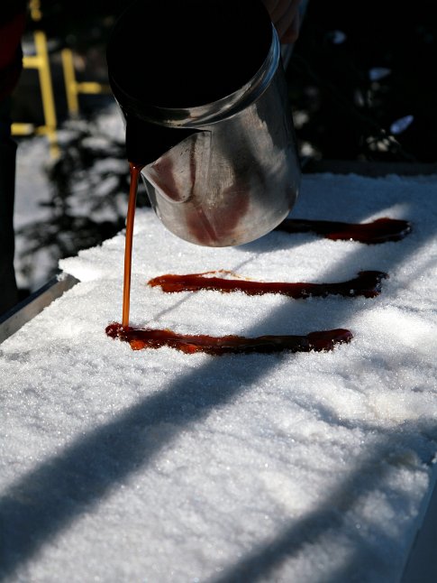 Serving Maple Taffy When Quebecers are fed up with the long snowy winter they pour some thickened maple syrup on it